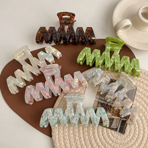 Large acetate wave hair claw clips in tortoise shell and marble colors for women
