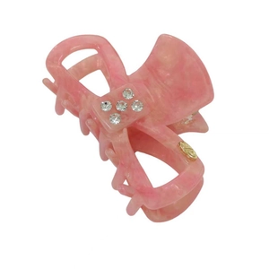 Pink marble acetate hair claw with sparkling crystals and golden bow design