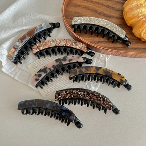 Classic double-toothed banana clips in various marble and tortoiseshell patterns