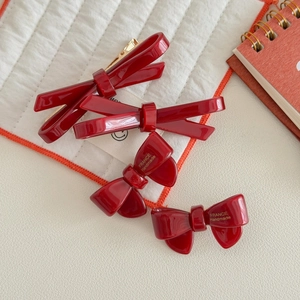 Deep red acetic acid bow hair clips set with France Handmade gold lettering on white quilt