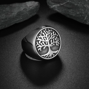 Mens silver stainless steel signet ring featuring a detailed tree of life relief on rock