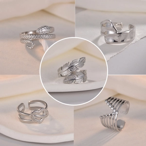 Set of silver adjustable rings featuring snake, leaf, and heart designs for women