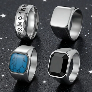 Detailed view of 4-piece hip hop rings set with runic patterns and turquoise stones