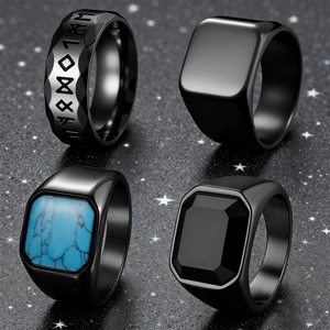 Set of four men's black rings featuring runic patterns, blue turquoise, and black gemstones
