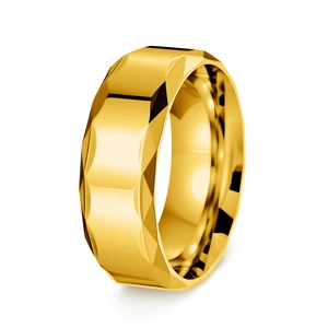 Macro view of gold faceted titanium steel ring with polished geometric cut surface