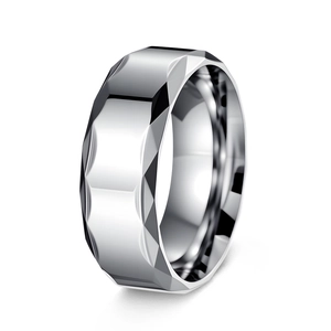 Macro detail of men's titanium steel ring with polished geometric faceted mirror design