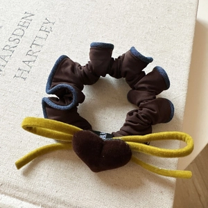 Brown velvet scrunchie with blue denim lace, yellow bow, and heart pendant accessory