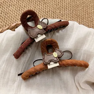 Brown suede shark hair clips with Scottish terrier leather patches for women
