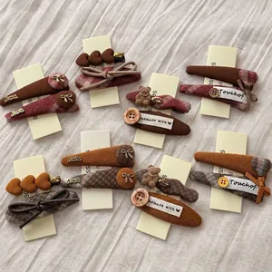 Plaid duckbill hair clips with teddy bear and bow designs for women's autumn style