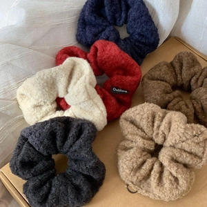 Set of six colorful faux shearling hair scrunchies in cozy autumn and winter style