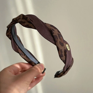 French vintage leopard print headband with twisted suede fabric and gold metal tag