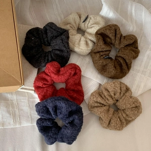 Set of 6 soft lamb wool scrunchies in autumn colors like beige, brown, and navy blue