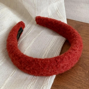 Detailed macro view of the soft lambskin plush texture on the thick sponge headband