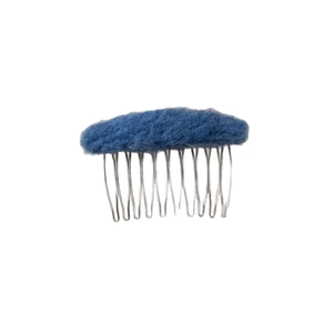 Oval plush hair comb with dark blue wool finish and silver metal teeth for styling