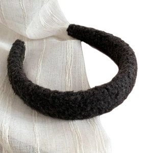 Thick dark brown lamb wool headband with a fluffy textured design for a high top hair look