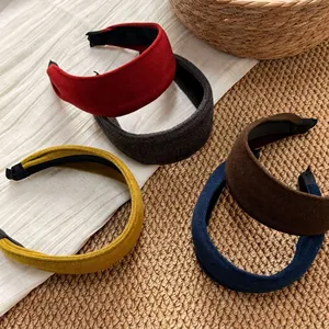 Five solid color velvet wide headbands in burgundy, navy, and yellow for women