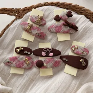 Cute pink and brown houndstooth hair clips set featuring plush bears and bows for girls