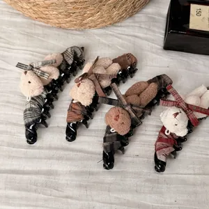 Cute teddy bear banana hair clips with plaid bows and plush details in warm colors