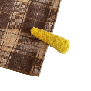 Fashionable yellow knit hair clip with warm fuzzy texture for autumn and winter styles
