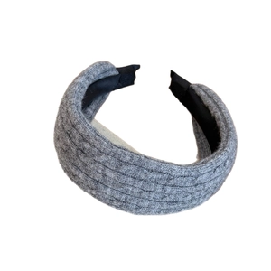 Dark grey knitted cable-stitch headband for women with black lining and soft winter texture