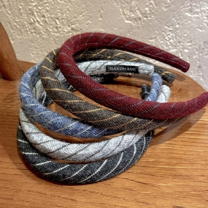 Five pack of twill fabric headbands in burgundy and assorted colors with handmade label