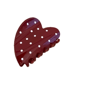 Polka dot heart shaped hair claw clip in deep red glossy finish for women's hair styling