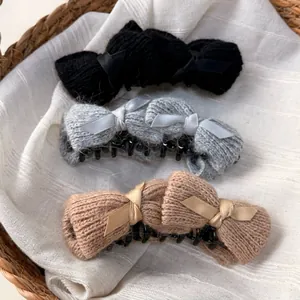 Knitted bow banana hair clips in black, gray, and khaki colors for elegant styling