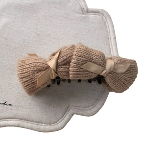 Brown knitted bow banana hair clip with elegant satin ribbons for stylish women hairstyle