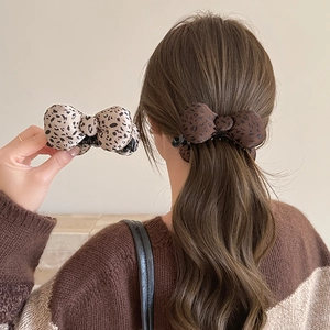 Leopard print bow hair clip for women with soft fabric texture in stylish autumn colors