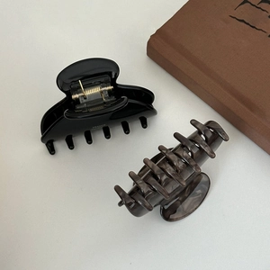 Elegant French acetate hair claw clips in solid black and marble grey finish
