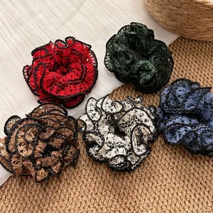 Five-pack vintage lace hair scrunchies with floral embroidery and wavy black trim