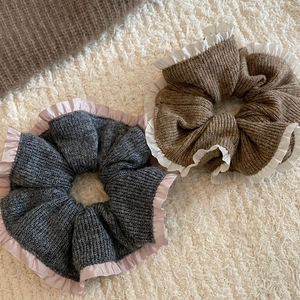 Elegant knit scrunchies in grey and brown with satin ruffles for stylish hairstyles