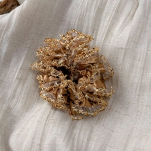Elegant champagne gold satin scrunchie with sparkling sequins and layered tulle ruffles