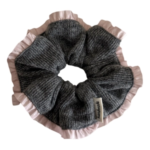 Grey knit scrunchie with pink satin ruffle trim and handmade label for bun hairstyle