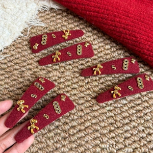 Red velvet Year of the Horse hair clip set with festive golden metal charms