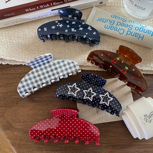 Set of five vintage French style acetate hair claws with floral and polka dot patterns