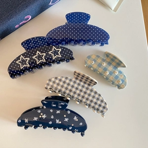 French vintage acetate hair claws in various patterns like polka dots and plaids