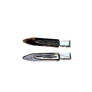 Pair of minimalist tortoiseshell hair clips with resin finish and silver metal duckbill base