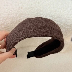 Close-up of coffee brown velvet headband with wide sponge design and non-slip lining