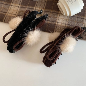 Velvet bow banana hair clips in black and coffee brown with soft white pom poms