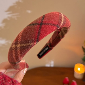 Close-up of red plaid velvet headband showing the thick texture and Hand Made label