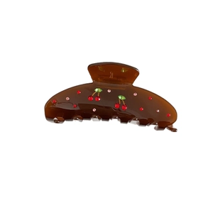French vintage dark brown acetate hair claw with cherry rhinestones on white background