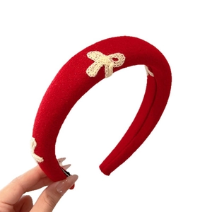 Red padded sponge headband with white crochet bows for vintage New Year style