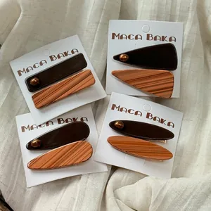 Set of four tortoiseshell and brown resin hair clips in geometric shapes for women