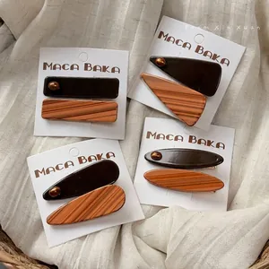 Brown and amber striped acetate hair clip set with elegant geometric shapes