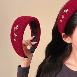 Elegant deep red velvet headband with golden rocking horse and festive snowflake patterns