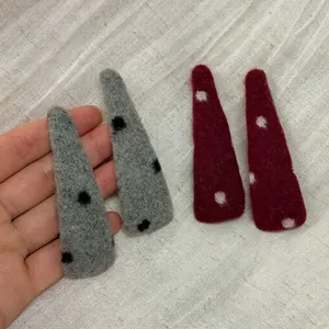 Handmade red and grey felt hair clips with polka dots in a minimalist Korean style