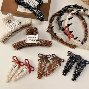 Winter collection of tweed hair clips and headbands with bow details in warm tones