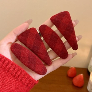 Set of four red checkered velvet hair clips including teardrop and triangle shapes