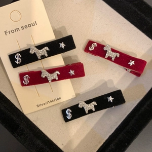 Vintage velvet hair clips featuring sparkling diamond pony and star motifs in black and red